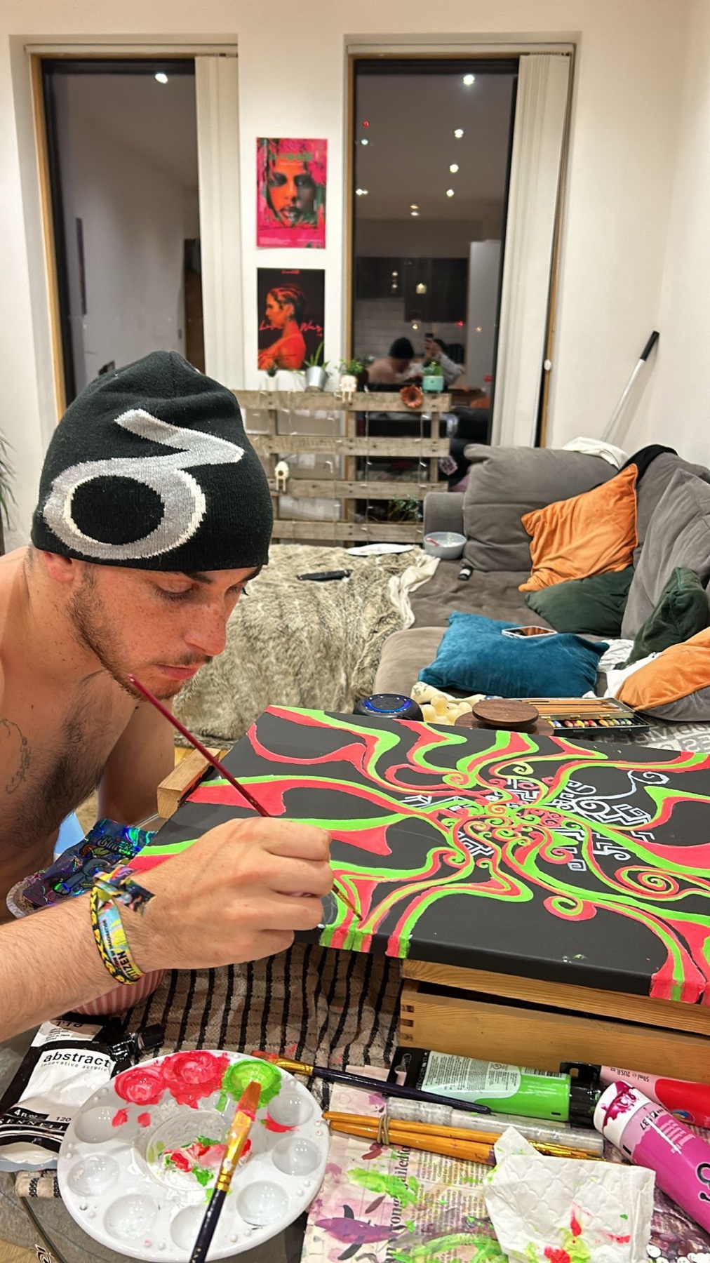 Benji painting artwork at home