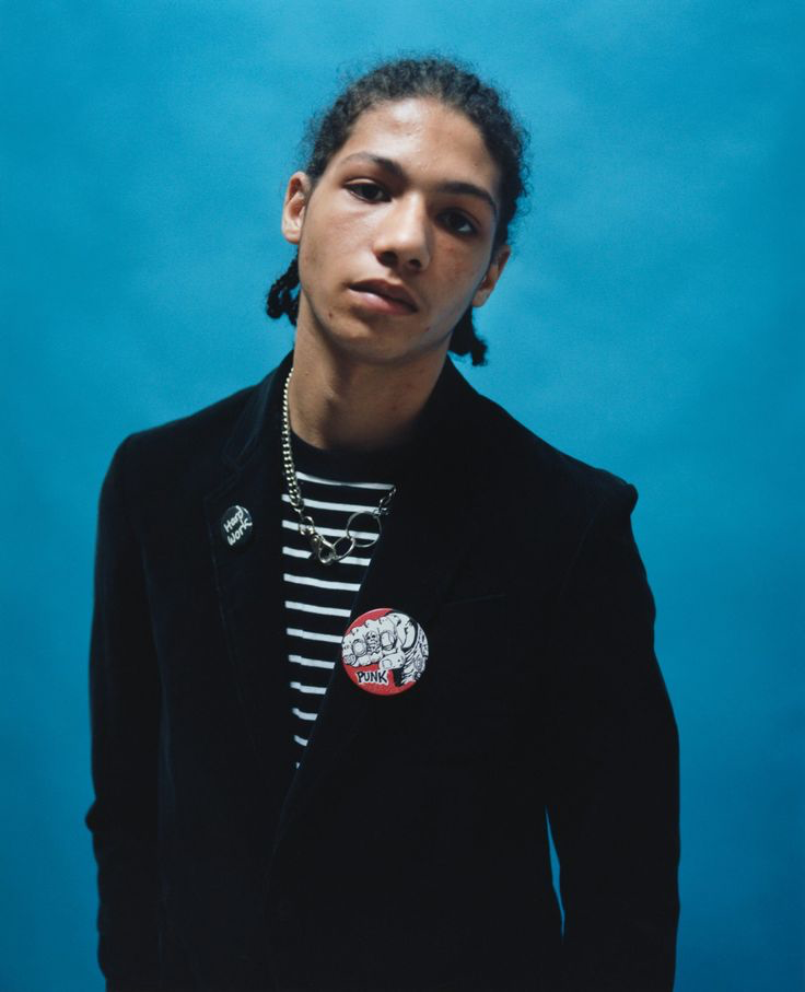 Tyrone Lebon portrait for Stüssy against a vivid blue background